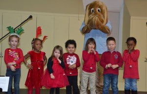 Singers from the Kids Academy Learning Center perform “Jingle Bells."