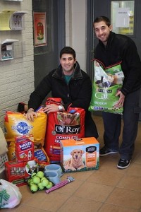 Pictured are brothers and Cherry Hill residents Wyatt A. Sklar, left, and Dylen S. Sklar, right, donating 150lbs of dog food and biscuits, 30lbs of cat food, dog toys, cat toys, bowls, towels and blankets to the Animal Welfare Association in Voorhees on New Year’s Eve. 