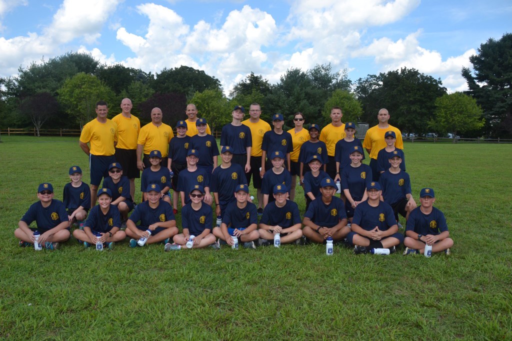 Instructors at Medford’s first Junior Police Academy camp stand behind their 26 cadet campers at Freedom Park on Tuesday, August 9.