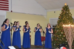 The Belles of Cherry Hill East perform “Let There Be Peace on Earth” during the township’s holiday lighting ceremony. l