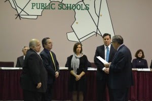 The Voorhees Township Board of Education held its reorganization meeting on Jan. 7. Those standing and being sworn in are, from left, Bruce Karpf, Richard Horner, Marissa Levy and Richard Nelson, with board solicitor Howard Mendelson reading the oath of office for the board members to recite.  