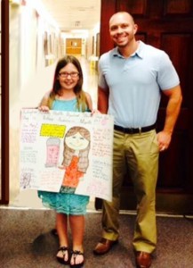 Meredith Waropay displays her winning poster with John Sivon, Director of Health Education for Burlington County. 