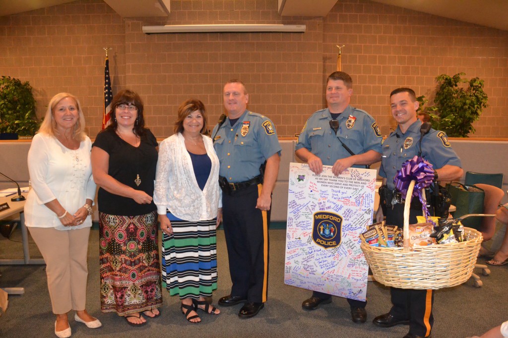 Left to right, The Woman’s Club of Medford members, Jolette Ewen, Cheri Locket and Alberta Wolf stand beside Chief of Police Richard J. Meder, Cpl. George Jackson and Officer C.J. Walsh after the Woman’s Club presented to police department with a card of thanks at the Town Council Meeting held on Tuesday, Sept. 7.