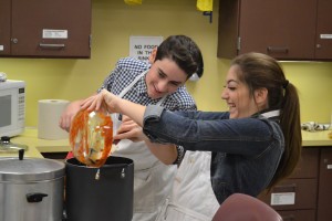 In the weeks leading up to the Marlton Middle School Empty Bowls fundraiser, art students sculpted and painted soup bowls, and family and consumer science students made soup. All money raised will go to the Food Bank of South Jersey, and guest will then take their bowl home with them. Pictured are eighth grade students Ryan Stango and Liv Gazzara as they work on cooking chili for the event.