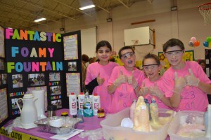 Hamilton students Isabella Giampetro, Matt Donnelly, Logan Cudeyro and Brian Baker conducted ‘Fantastic Foamy Fountain’ at the 2014 science fair on Feb. 25. To make foam fountains, the group used materials such as dish soap, hydrogen peroxide, yeast and hot water, and water bottles.