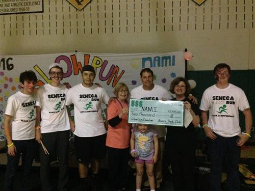 (Pictured from left to right) Colton Adams (guitar), Evan McNally (drums),  Quin Gidzinski (bass), Brenda Hahn (NAMI Face) Sean Kennevan (Psychology Club Advisor), Caroline Kennevan, Patricia Klint (NAMI Face) & Jonathan Klenk (vocals)