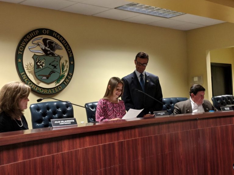 Pleasant Valley youngster reads her essay while seated in the mayor’s chair