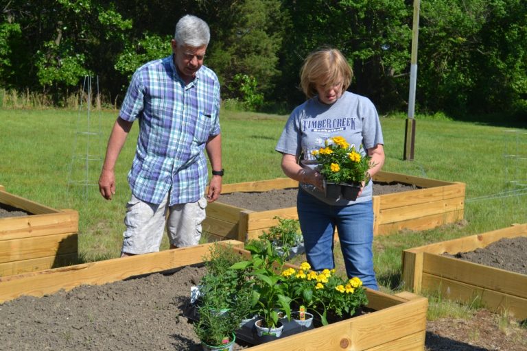 The Gloucester Township Family Resource Center and the Kiwanis Club get their hands dirty to create…