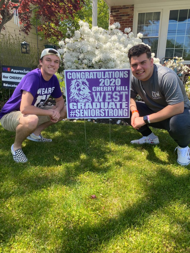 West volunteers provide signs of hope for graduating seniors