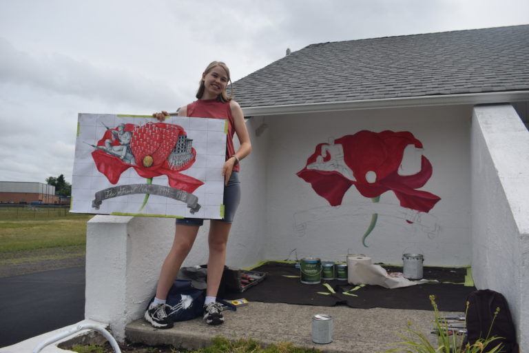 West junior paints mural at American Legion Post 372